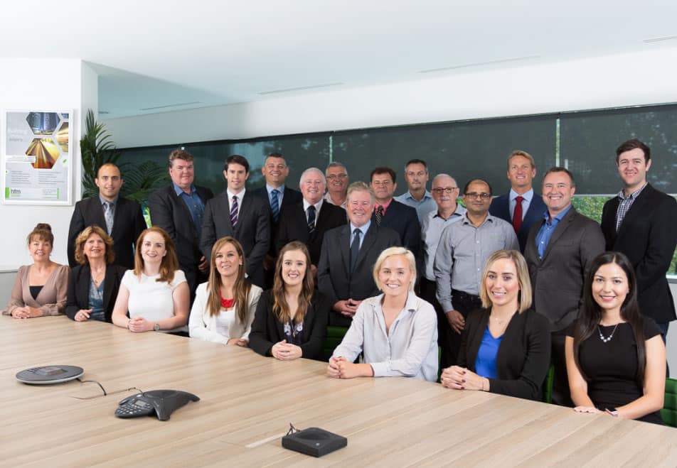 HFM Asset management team gather in the meeting room