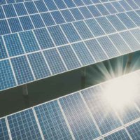 Solar panels with sun reflection shining